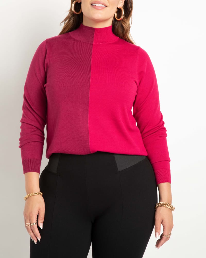 Front of a model wearing a size 14/16 Iris Vertical Colorblocked Turtleneck in Sangria And Plum by ELOQUII. | dia_product_style_image_id:242103